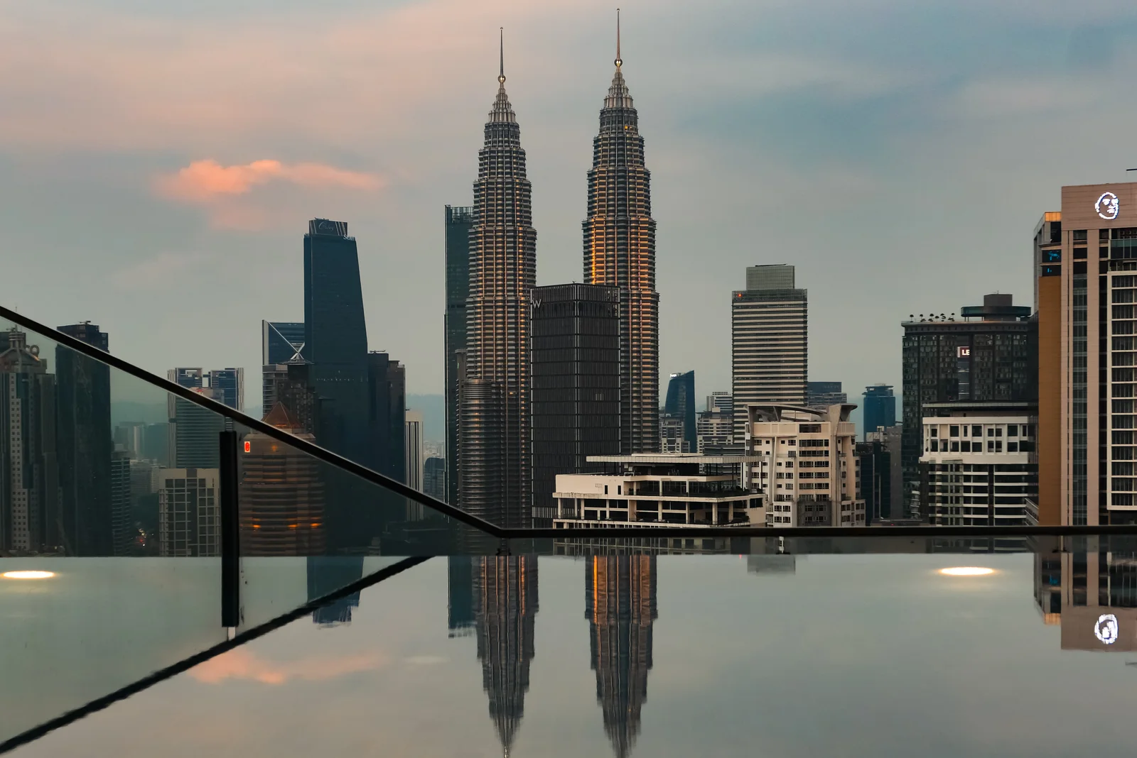 Skybridge with the city skyline reflected below