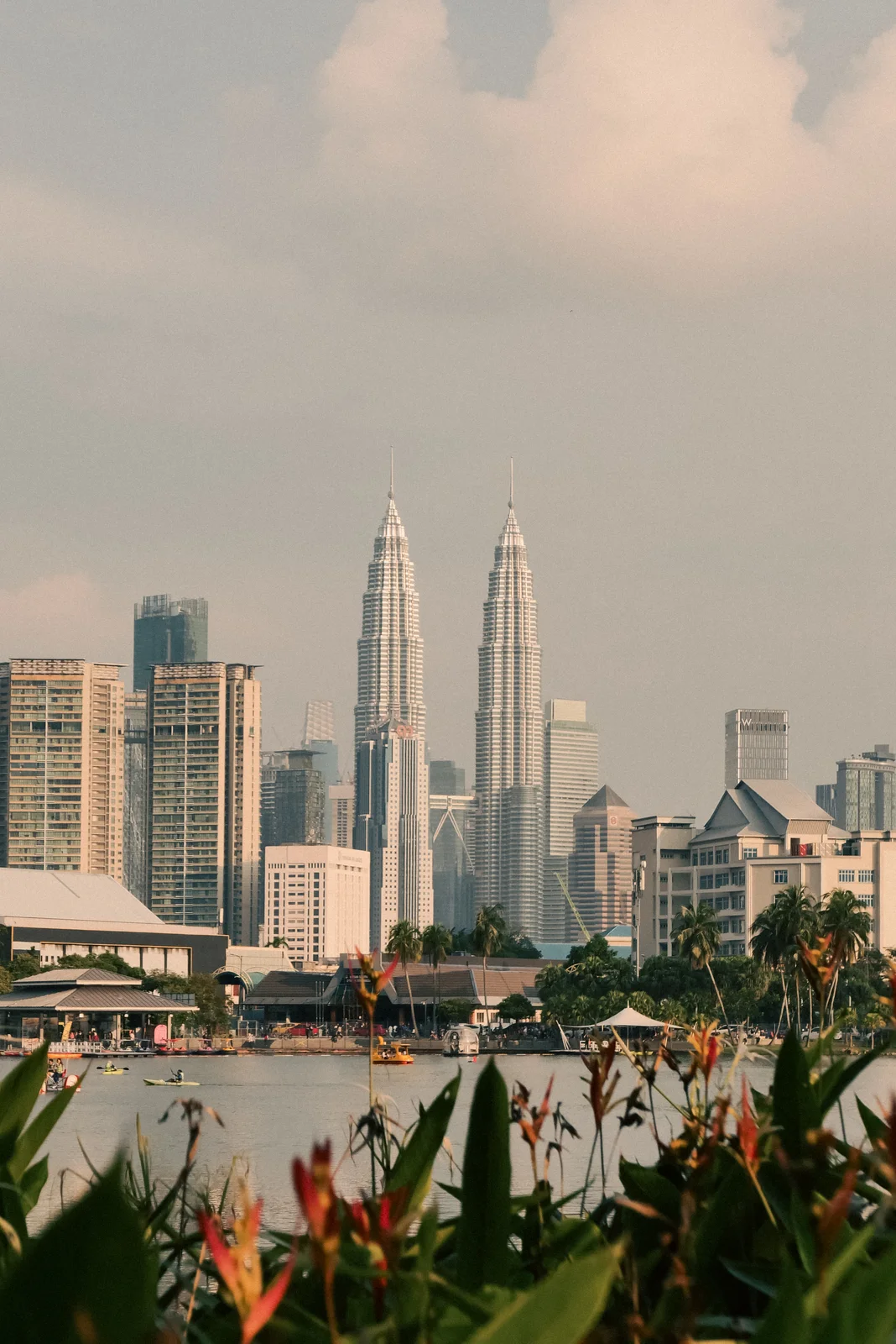 The Petronas Towers over the water at dusk