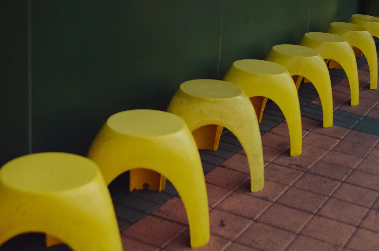 A row of yellow stools, shot on film