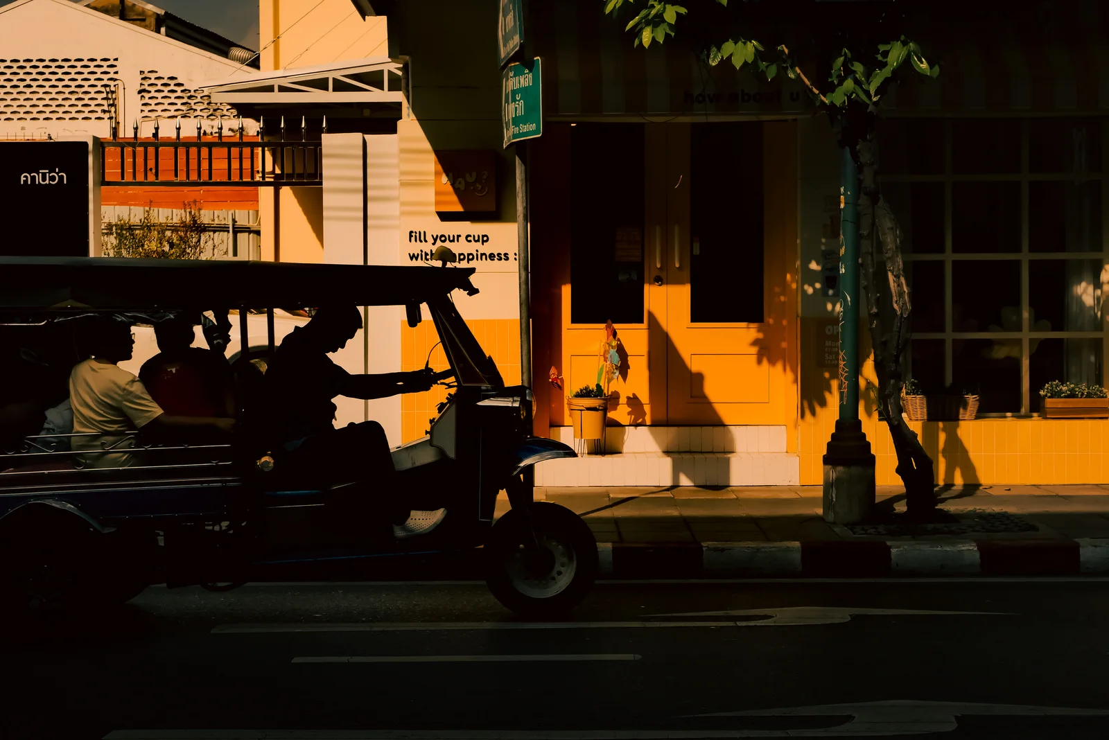 Tuk-tuks parked along the street